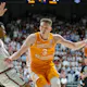Dalton Knecht #3 of the Tennessee Volunteers drives to the basket during the first half against Rylan Griffen #3 as we make our best March Madness MVP predictions. 