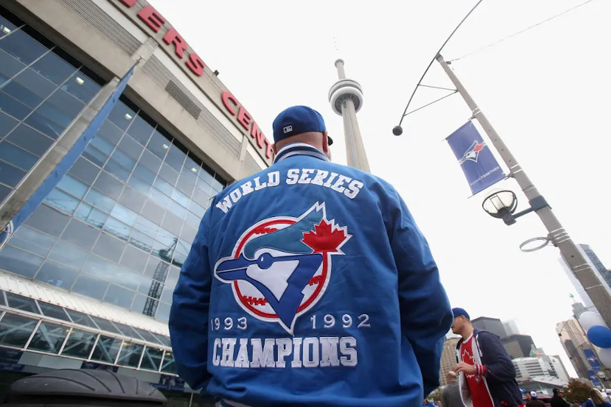 A fan waits outside the Rogers Centre as we look at the launch of Soft2Bet in Ontario