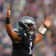 Jalen Hurts of the Philadelphia Eagles reacts after scoring a touchdown during the first quarter against the New Orleans Saints at Lincoln Financial Field on November 21, 2021 in Philadelphia, Pennsylvania. Photo by Mitchell Leff Getty Images via AFP.