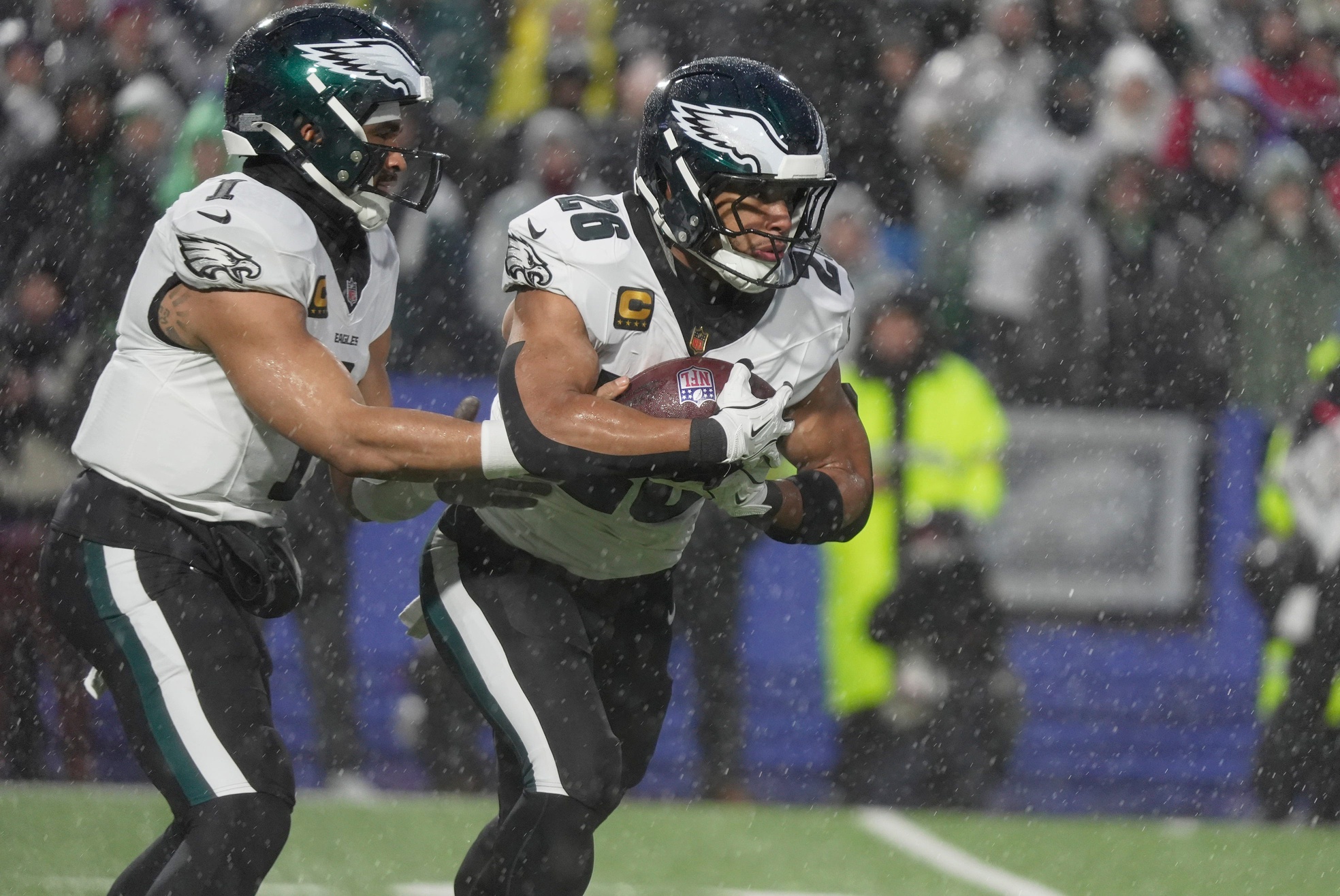 Jalen Hurts hands the ball off to running back Saquon Barkley as we provide the Super Bowl Odds after Week 17. 