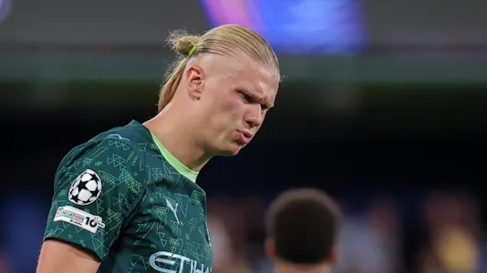 Erling Haaland stands and reacts to a play as we make our Premier League predictions for Matchweek 9