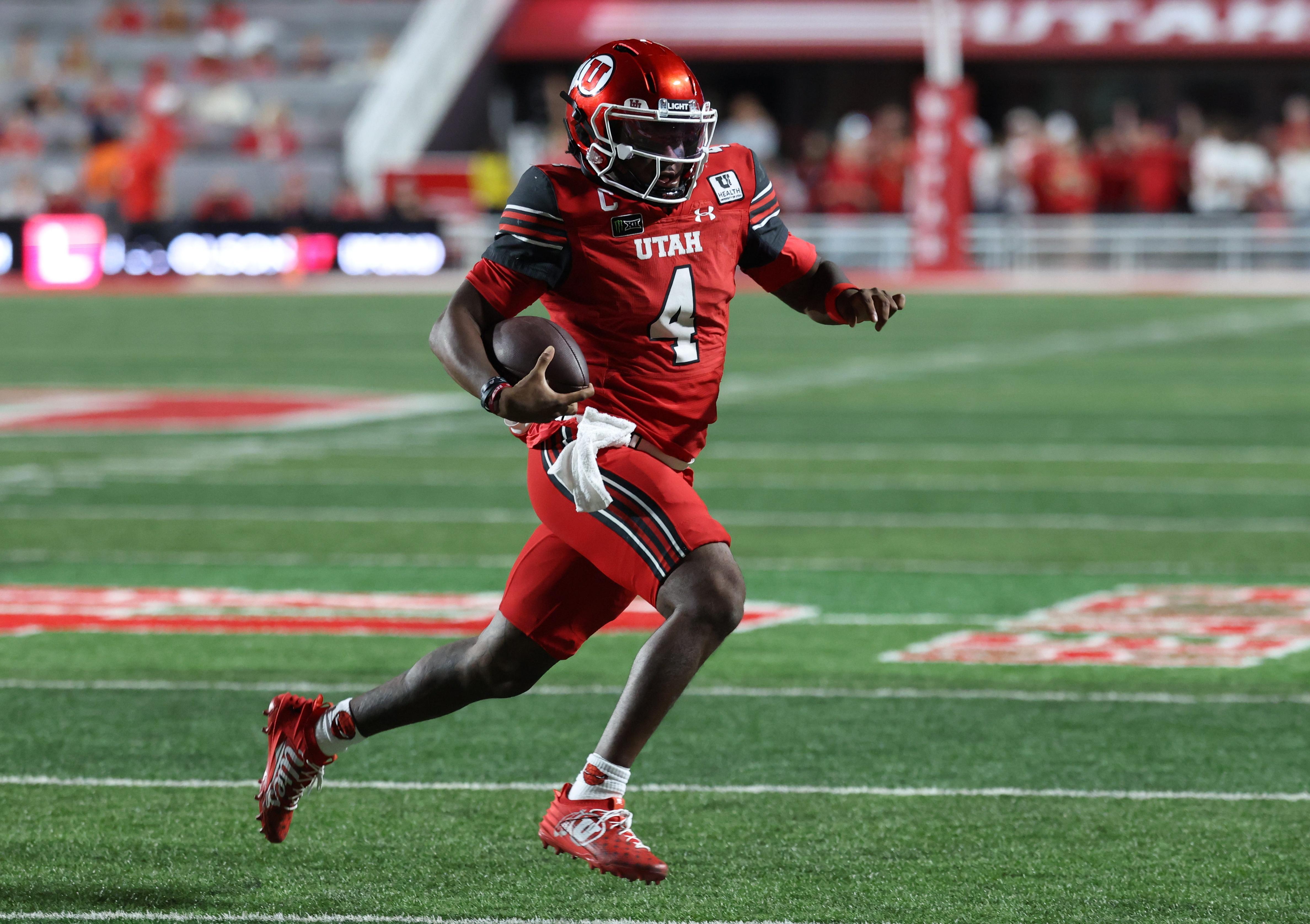 Devon Dampier running the football as we break down our Arkansas vs. Utah prediction. Photo by Rob Gray-Imagn Images.