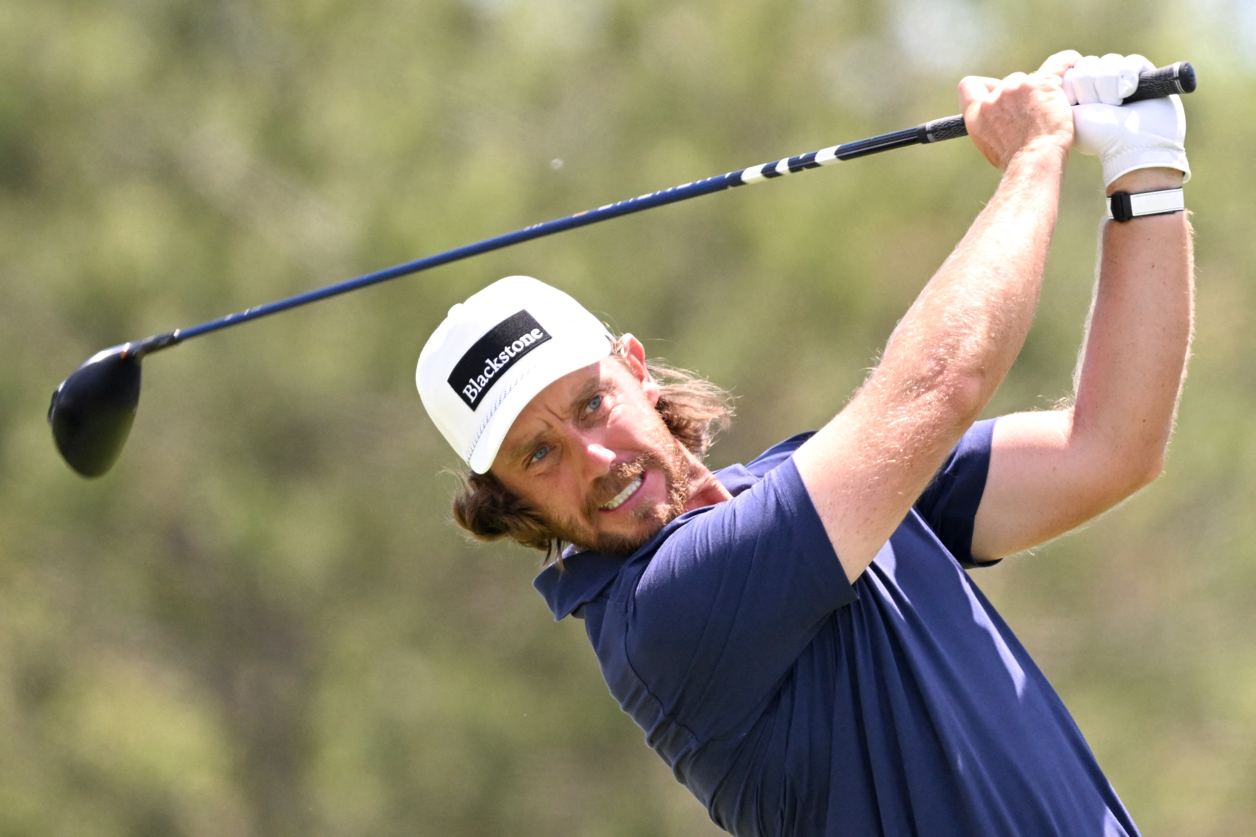Tommy Fleetwood hits his tee shot as he is featured in our RBC Canadian Open fourth-Round prop prediction & odds.