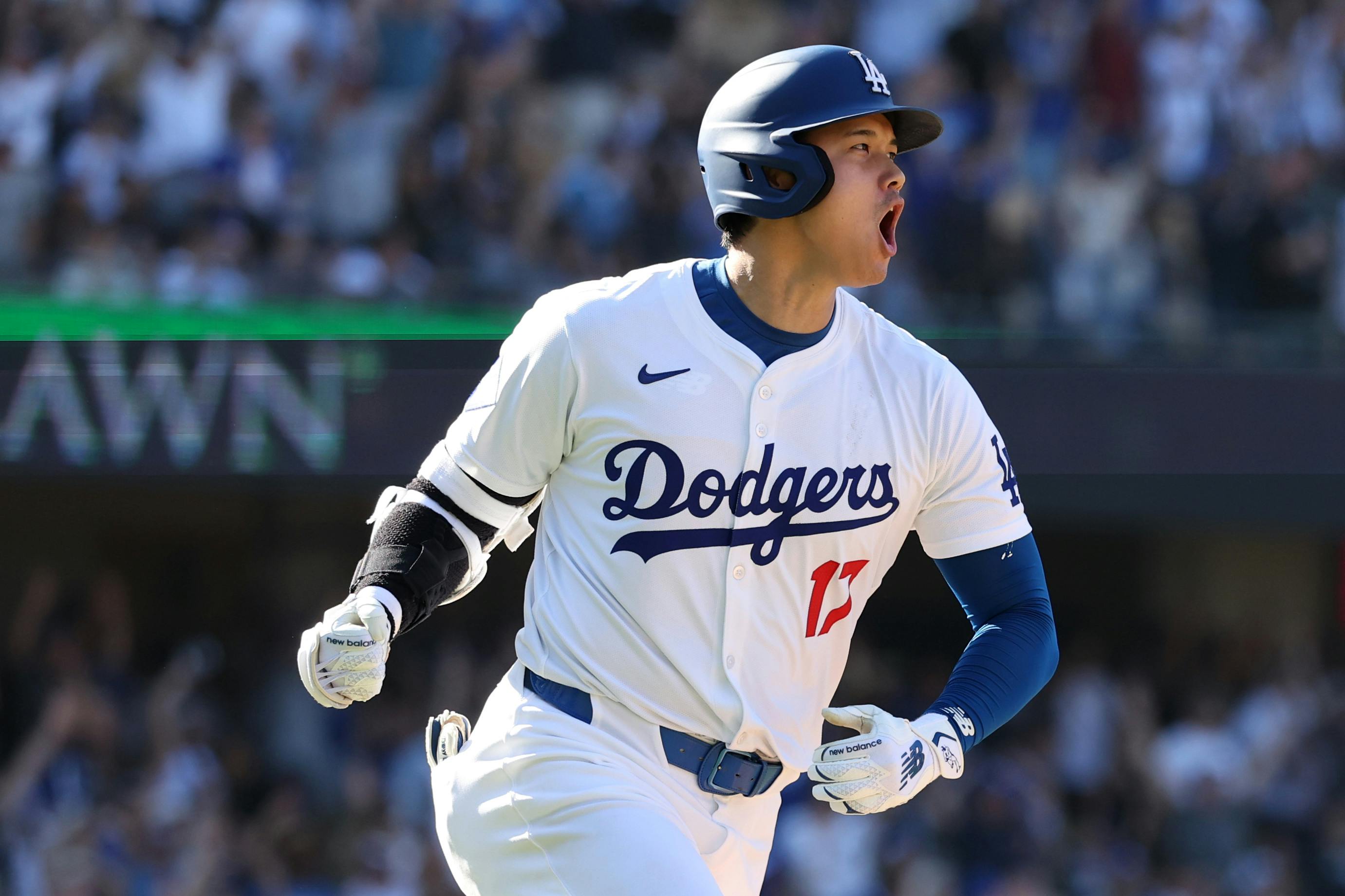 Shohei Ohtani celebrates on a game tying solo home run during the ninth inning against the Colorado Rockies at Dodger Stadium.