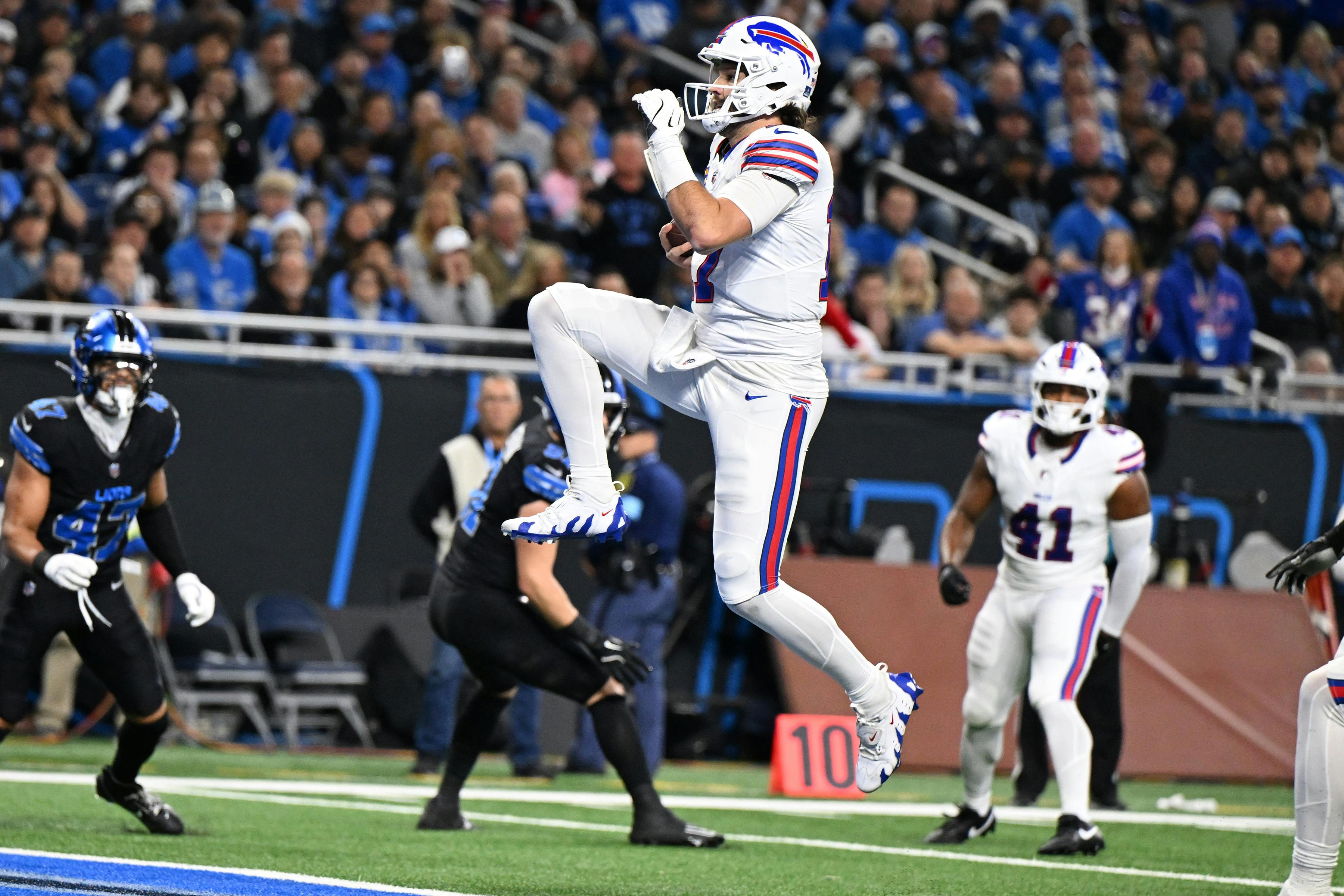 Buffalo Bills quarterback Josh Allen leaps across the goal line for his second touchdown against the Detroit Lions as we analyze the 2025 Super Bowl odds. 