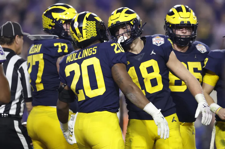 Kalel Mullings of the Michigan Wolverines celebrates after a touchdown during the third quarter against the TCU Horned Frogs, and we offer our top picks for East Carolina vs. Michigan.
