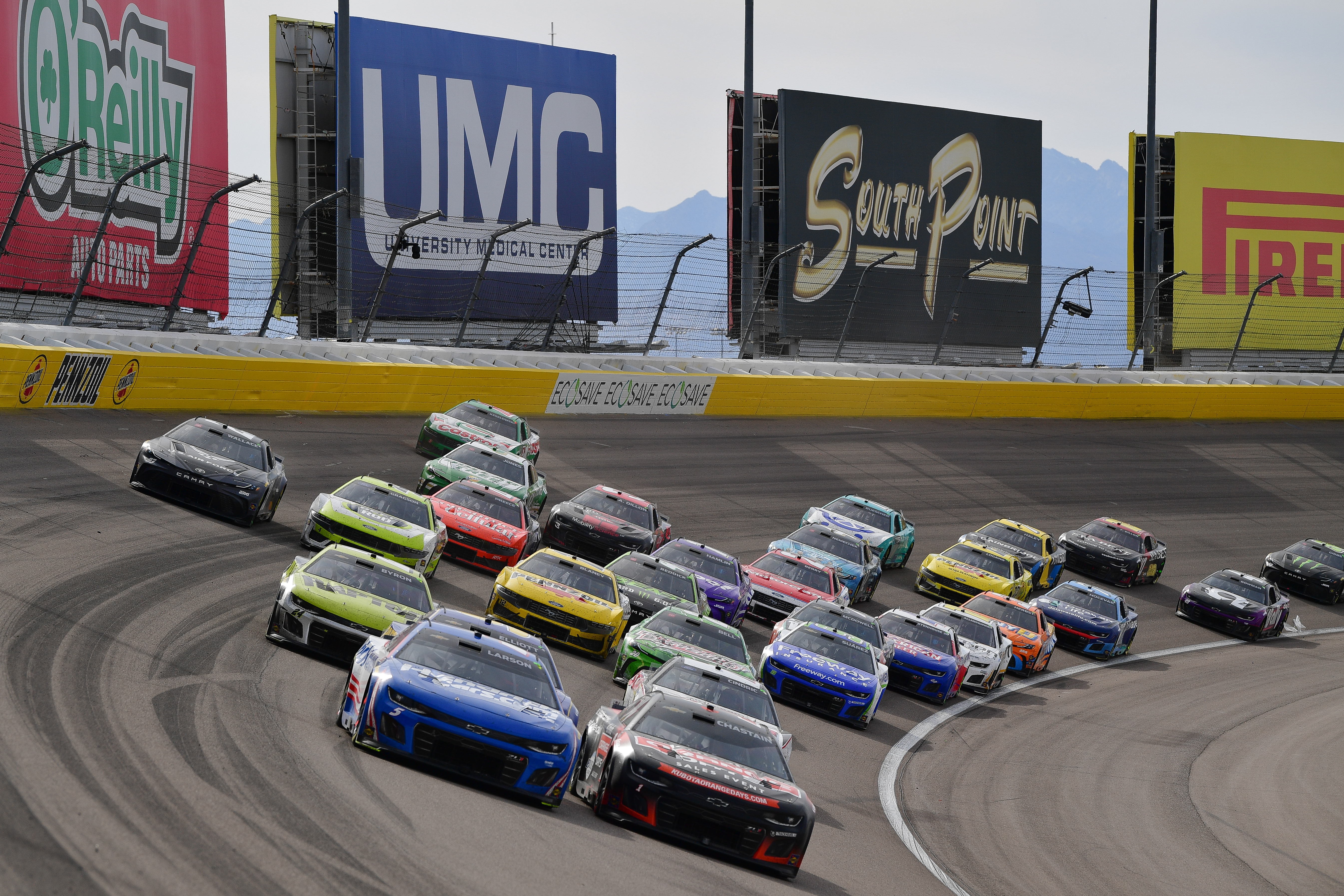 NASCAR Cup Series driver Kyle Larson (5) and driver Ross Chastain (1) lead the field for the restart during the Pennzoil 400 at Las Vegas Motor Speedway.
