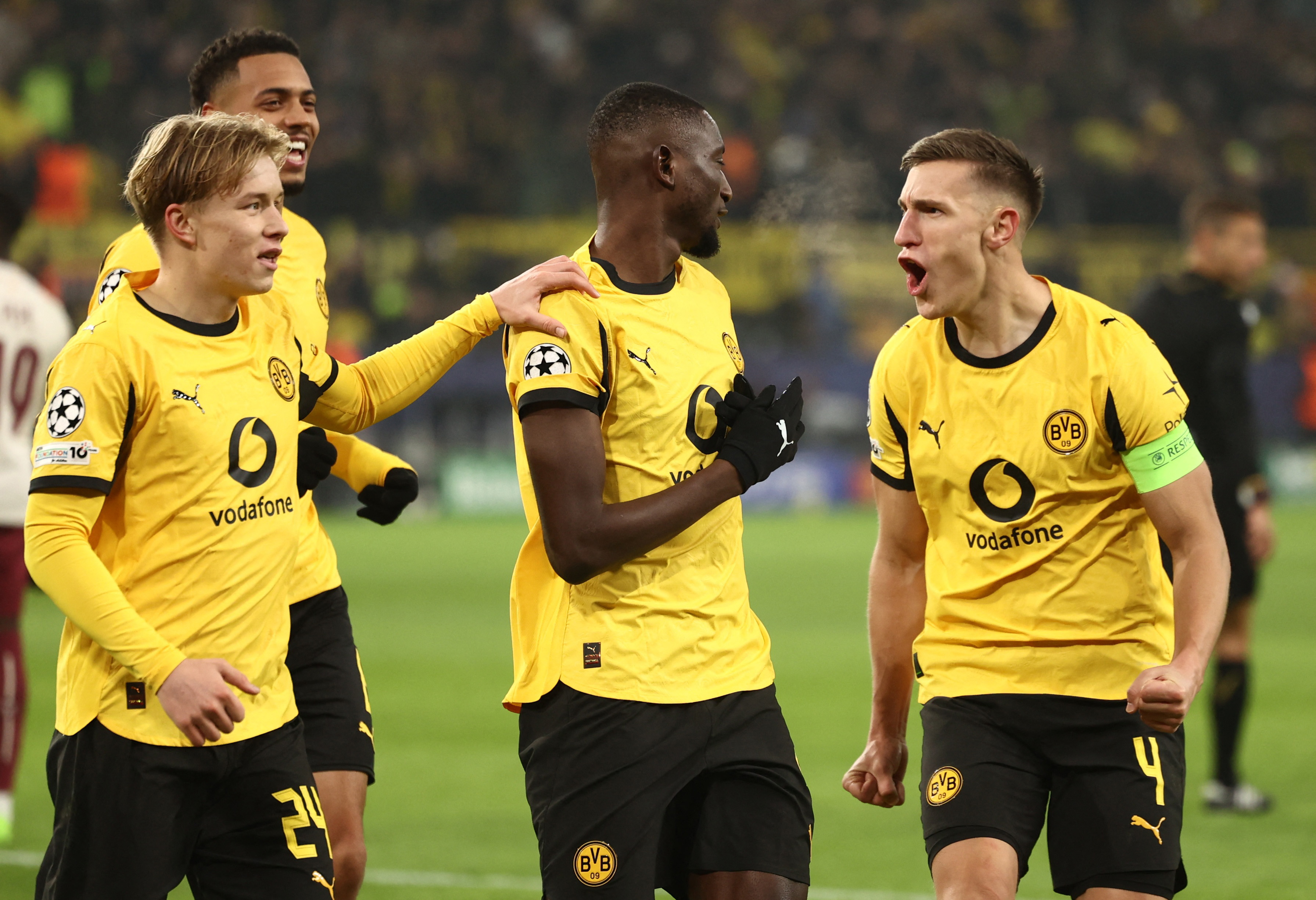 Borussia Dortmund's Serhou Guirassy celebrates with teammates as we offer our Borussia Dortmund vs. Tottenham prediction.