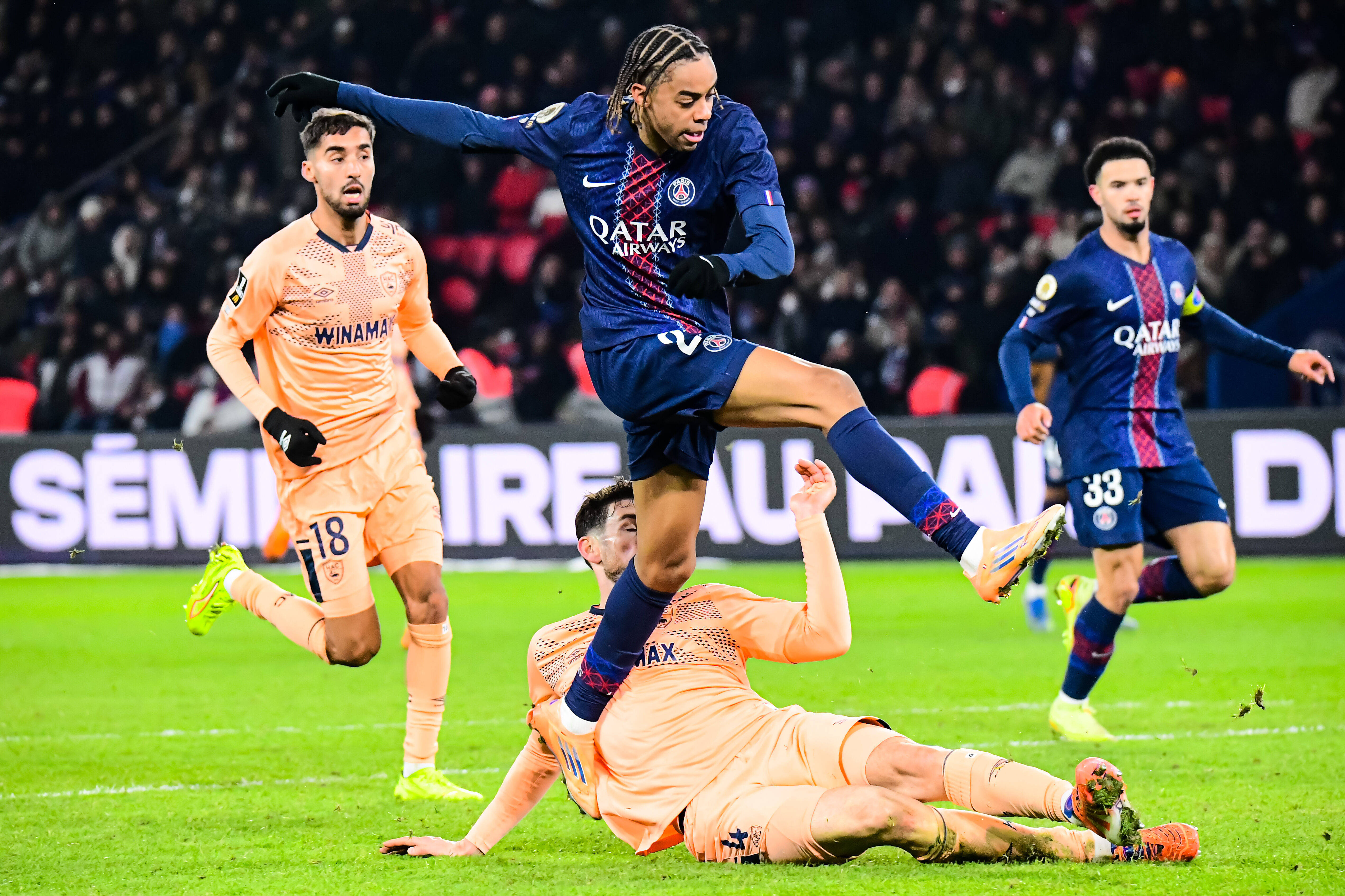 PSG's Bradley Barcola jumps in the air as we offer our PSG vs. Tottenham prediction today