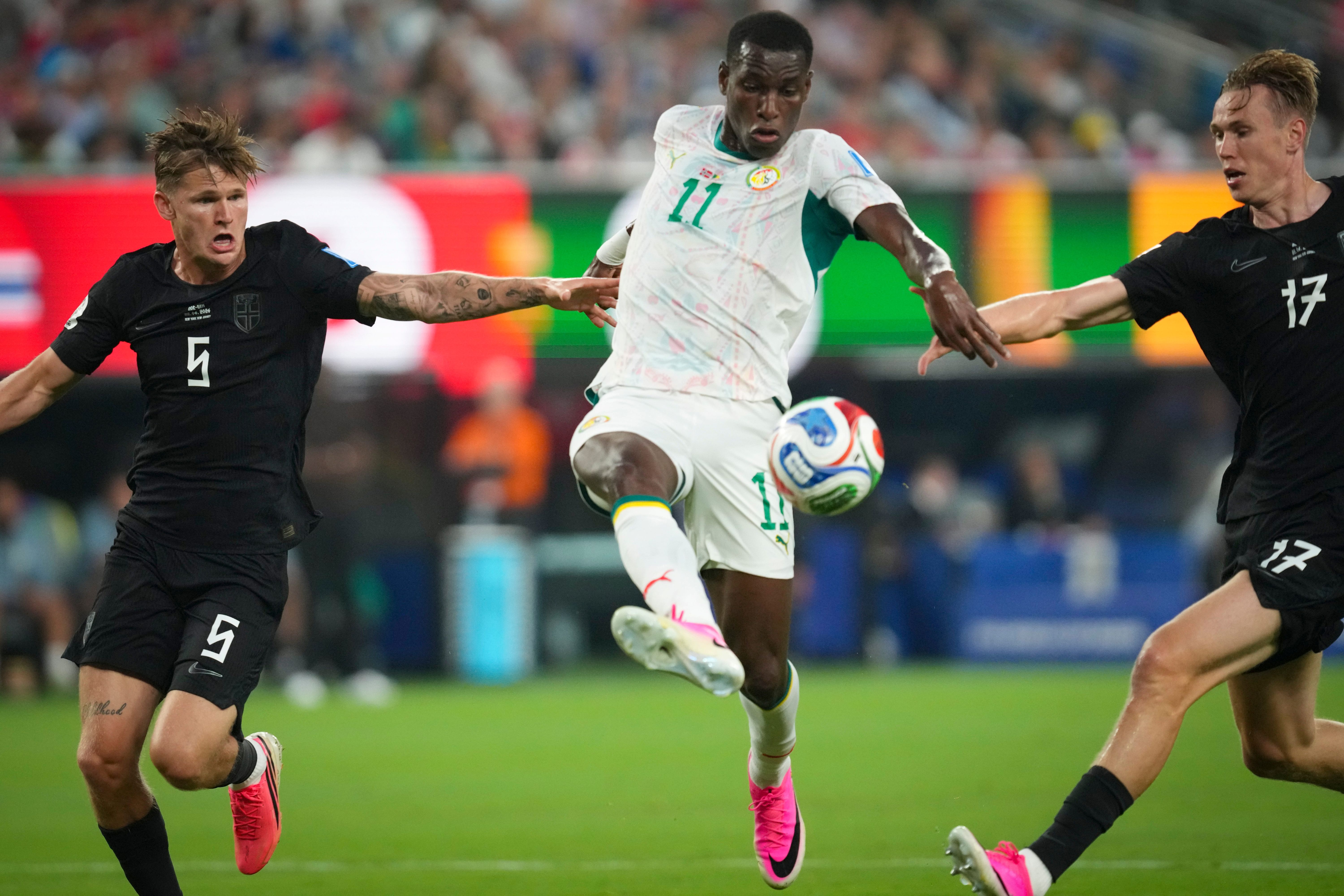 Senegal forward Nicolas Jackson attempts a shot as we make our best Senegal vs. Iraq prediction. 
