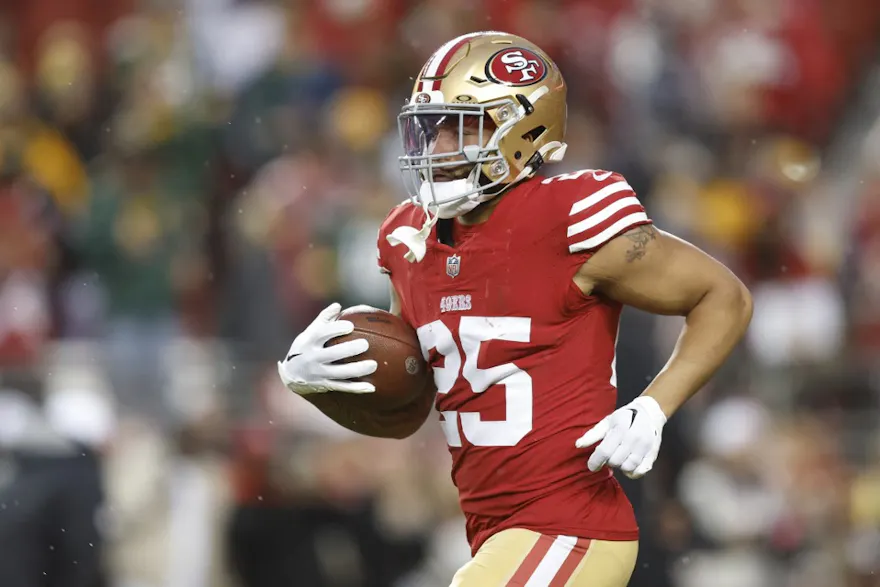 Elijah Mitchell of the San Francisco 49ers warms up before the NFC Divisional Playoffs as we look at the 2024 Super Bowl betting trends to know