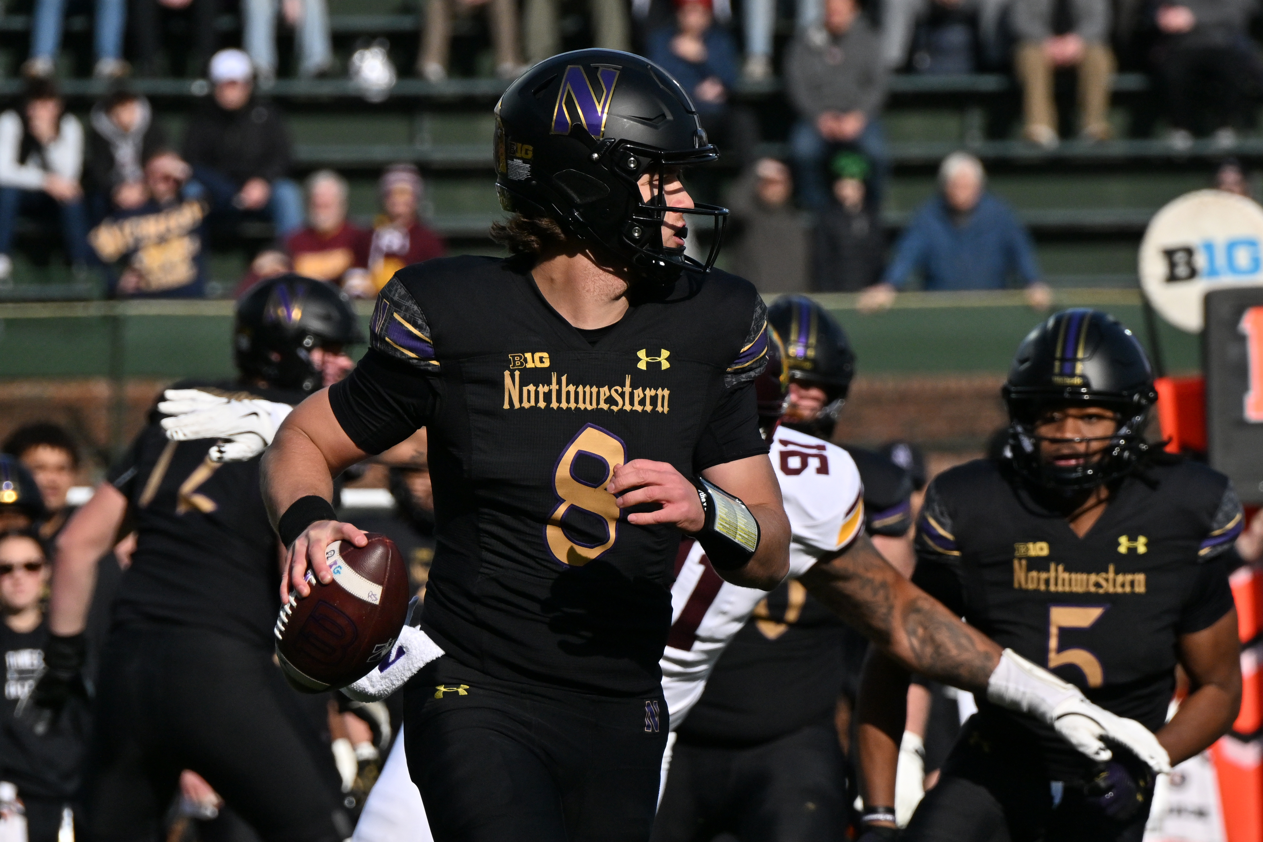 Northwestern Wildcats quarterback Preston Stone (8) scans the field as we dive into our Central Michigan vs. Northwestern predictions.