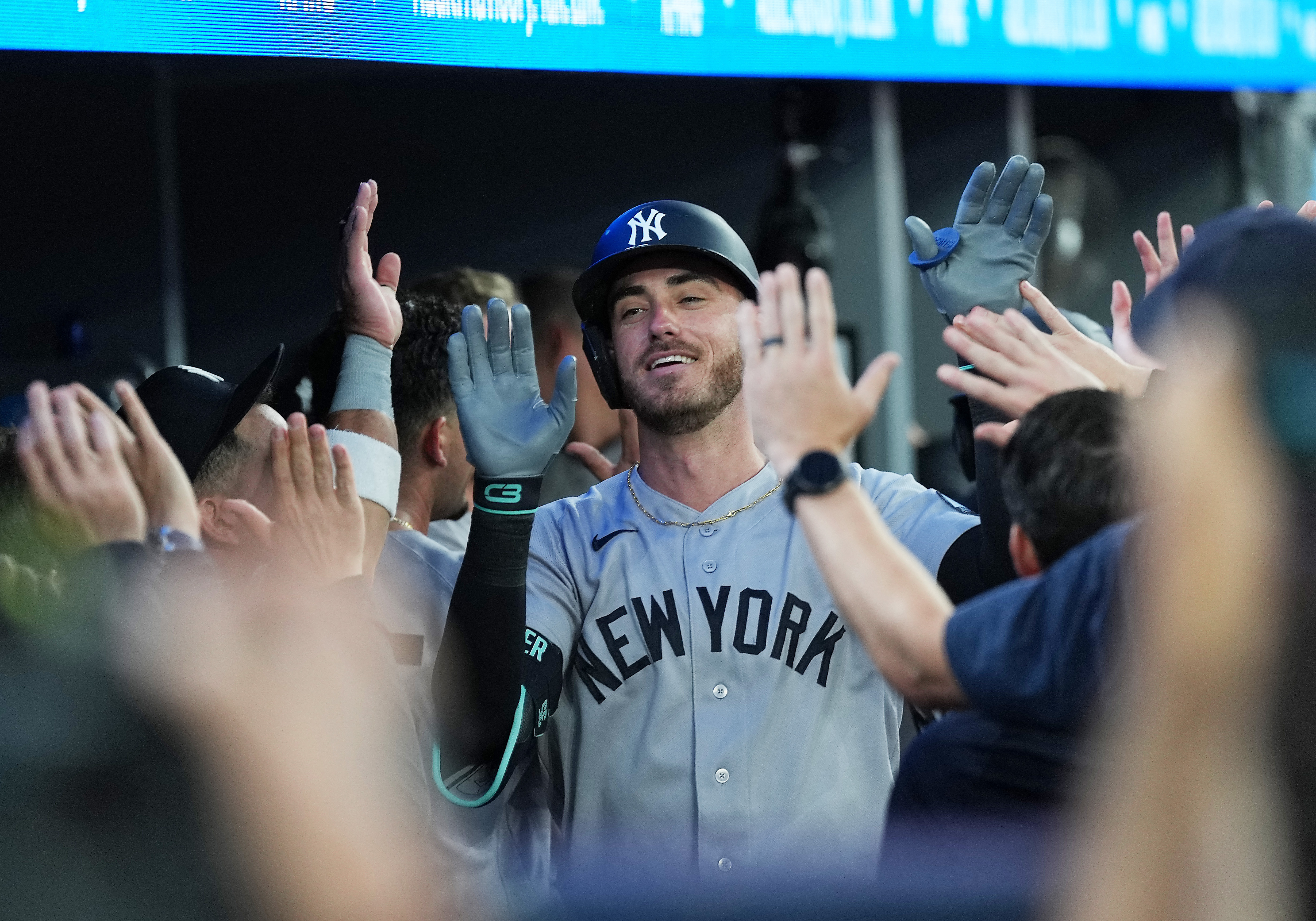 New York Yankees left fielder Cody Bellinger (35) celebrates in the dugout as he is featured in our White Sox vs Yankees win probability.