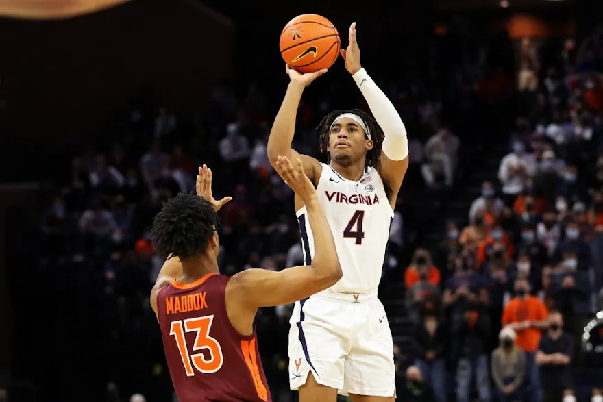 Armaan Franklin of the Virginia Cavaliers shoots over Darius Maddox of the Virginia Tech Hokies in the second half during a game at John Paul Jones Arena.