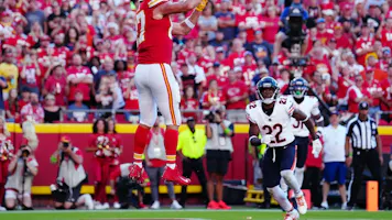 Travis Kelce of the Kansas City Chiefs catches a touchdown pass against the Chicago Bears, and we offer our top Chiefs vs. Jets predictions based on the best NFL odds.