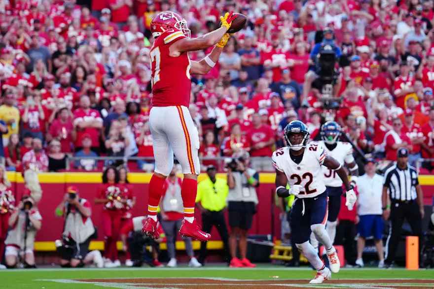 Travis Kelce of the Kansas City Chiefs catches a touchdown pass against the Chicago Bears, and we offer our top Chiefs vs. Jets predictions based on the best NFL odds.