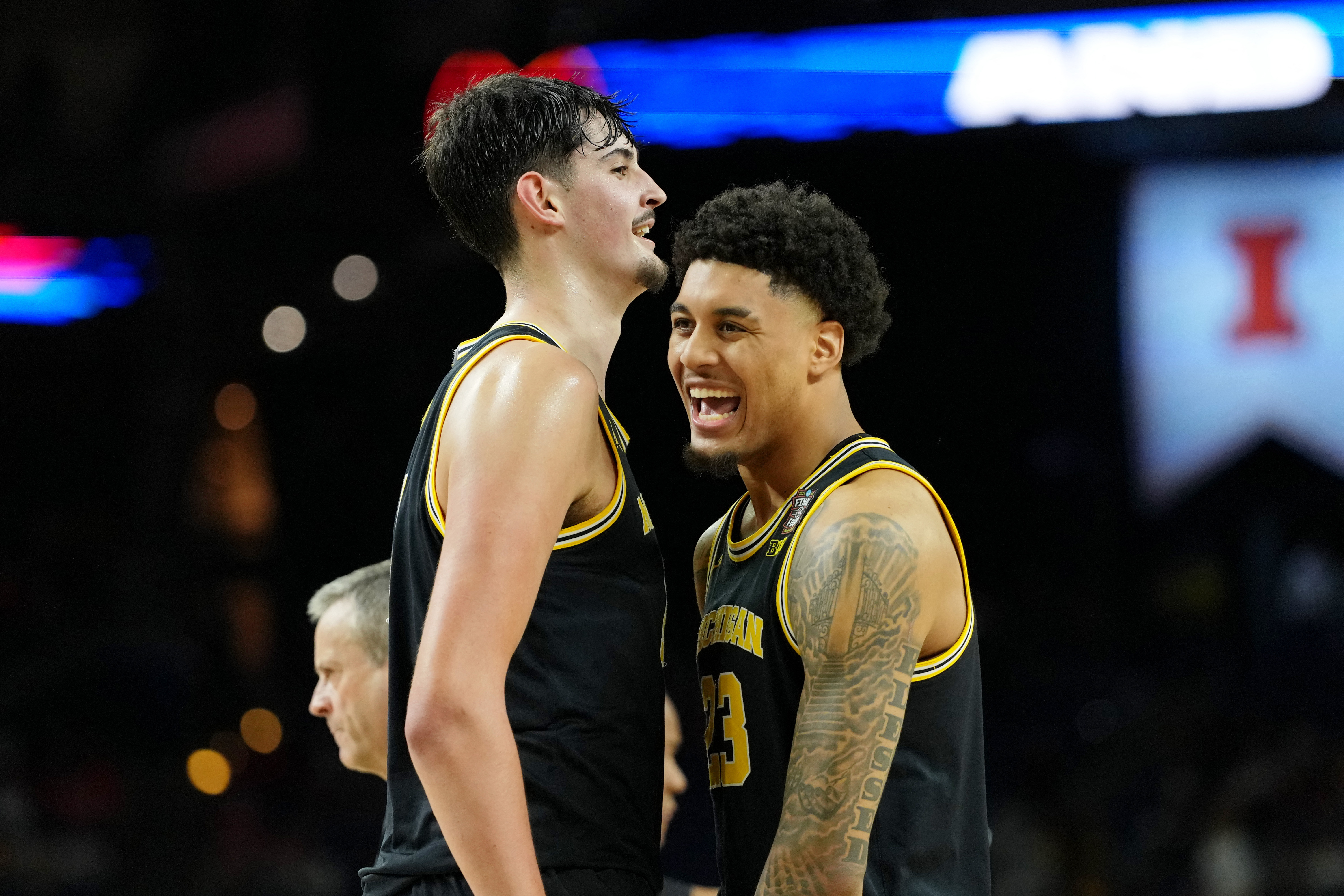 Michigan Wolverines center Aday Mara (15) and forward Yaxel Lendeborg (23) react during the Final Four at Lucas Oil Stadium.