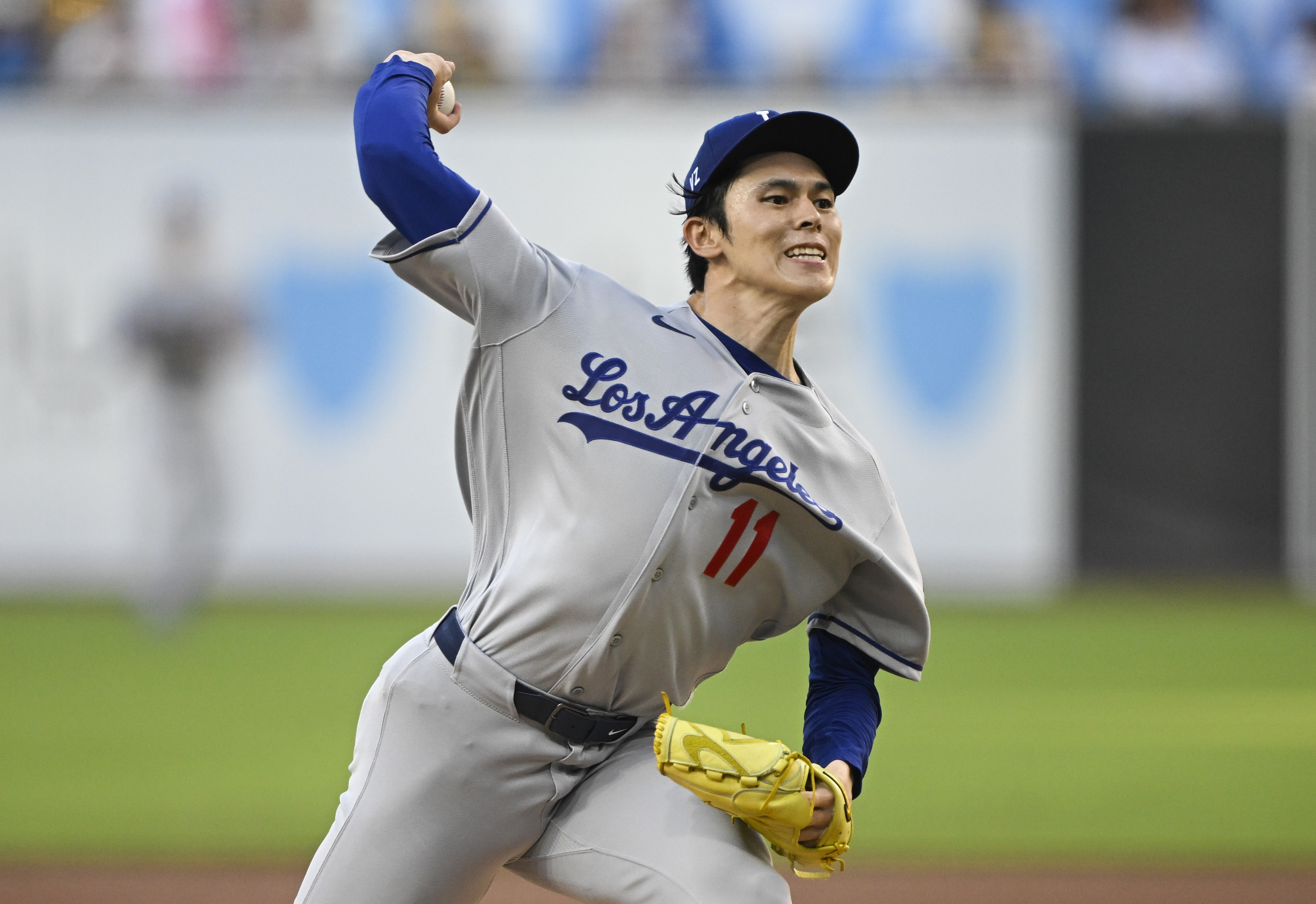 Los Angeles Dodgers pitcher Roki Sasaki (11) delivers as we break down our Padres vs. Dodgers win probability.