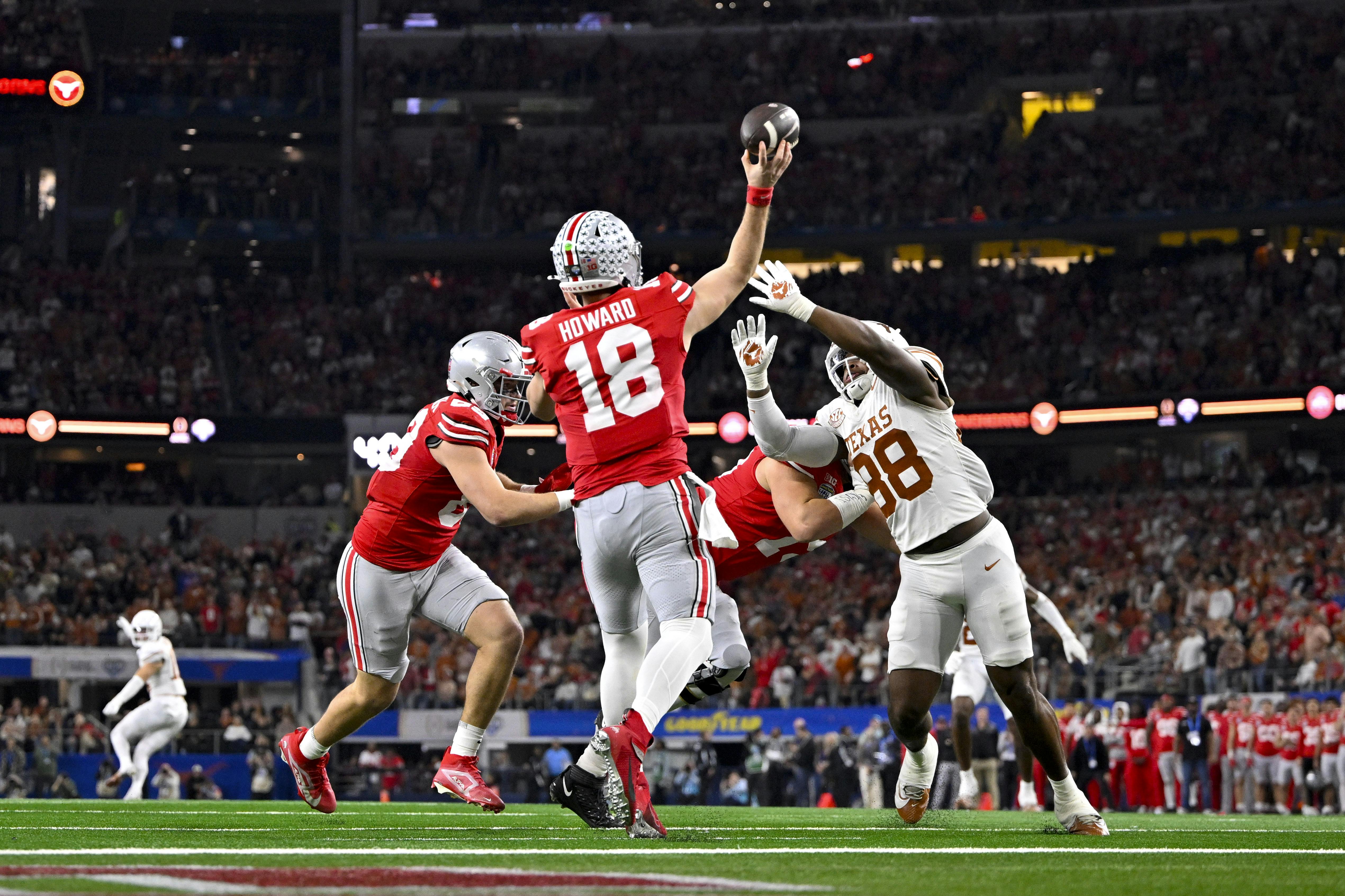 Ohio State quarterback Will Howard passes over Texas defender Barryn Sorrell. We highlight Howard in our Ohio State football preview.