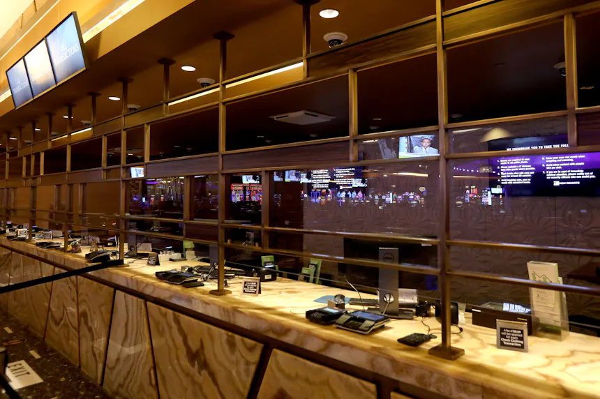 Glass partitions separate the public from the cashier when they cash in their chips inside the MGM Grand Detroit as we look at Michigan land-based casino revenues for November 2024.