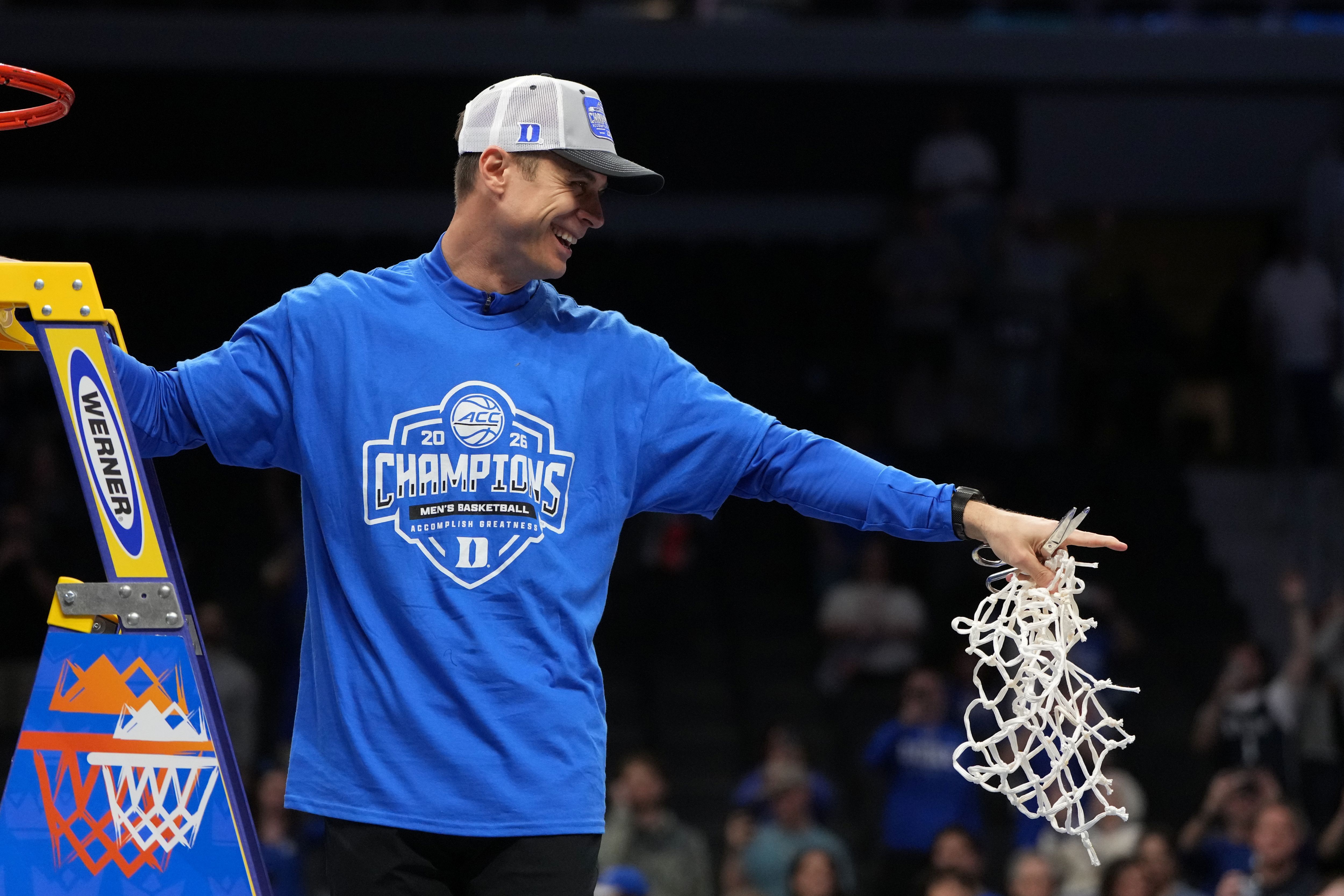 Duke Blue Devils head coach Jon Scheyer cuts down the net in the ACC Tournament. Duke leads our March Madness AI predictions.