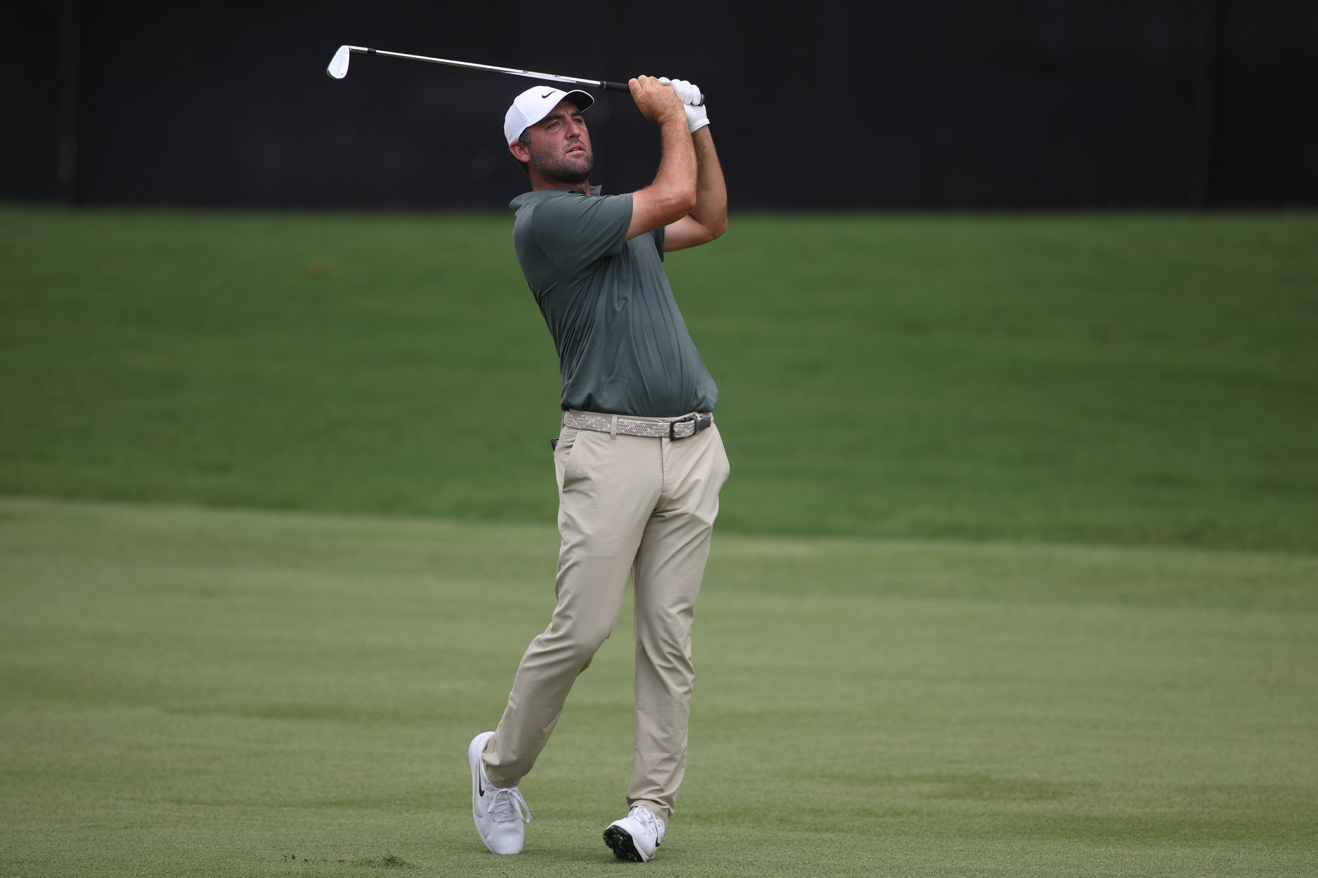 Scottie Scheffler plays his shot on the first hole as he is featured in our TOUR Championship Third-Round leader prediction.