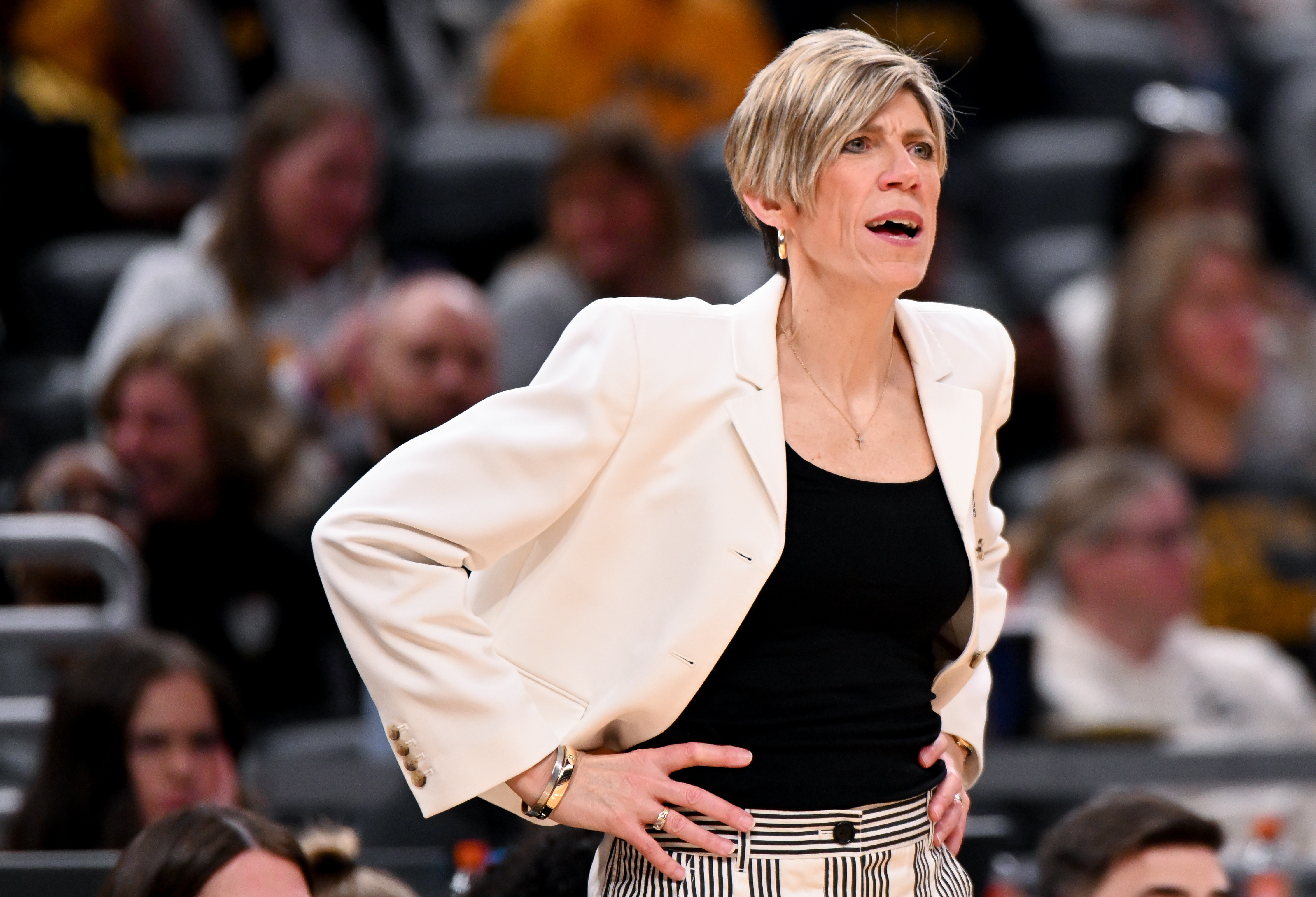 Iowa Hawkeyes head coach Jan Jensen, featured in our Fairleigh Dickinson vs. Iowa prediction, looks on during a game against UCLA at Gainbridge Fieldhouse.