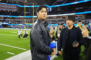 Los Angeles Dodgers player Shohei Ohtani and interpreter Ippei Mizuhara attend a football game as we cover the guilty plea from the California bookie who accepted Mizuhara's illegal wagers.