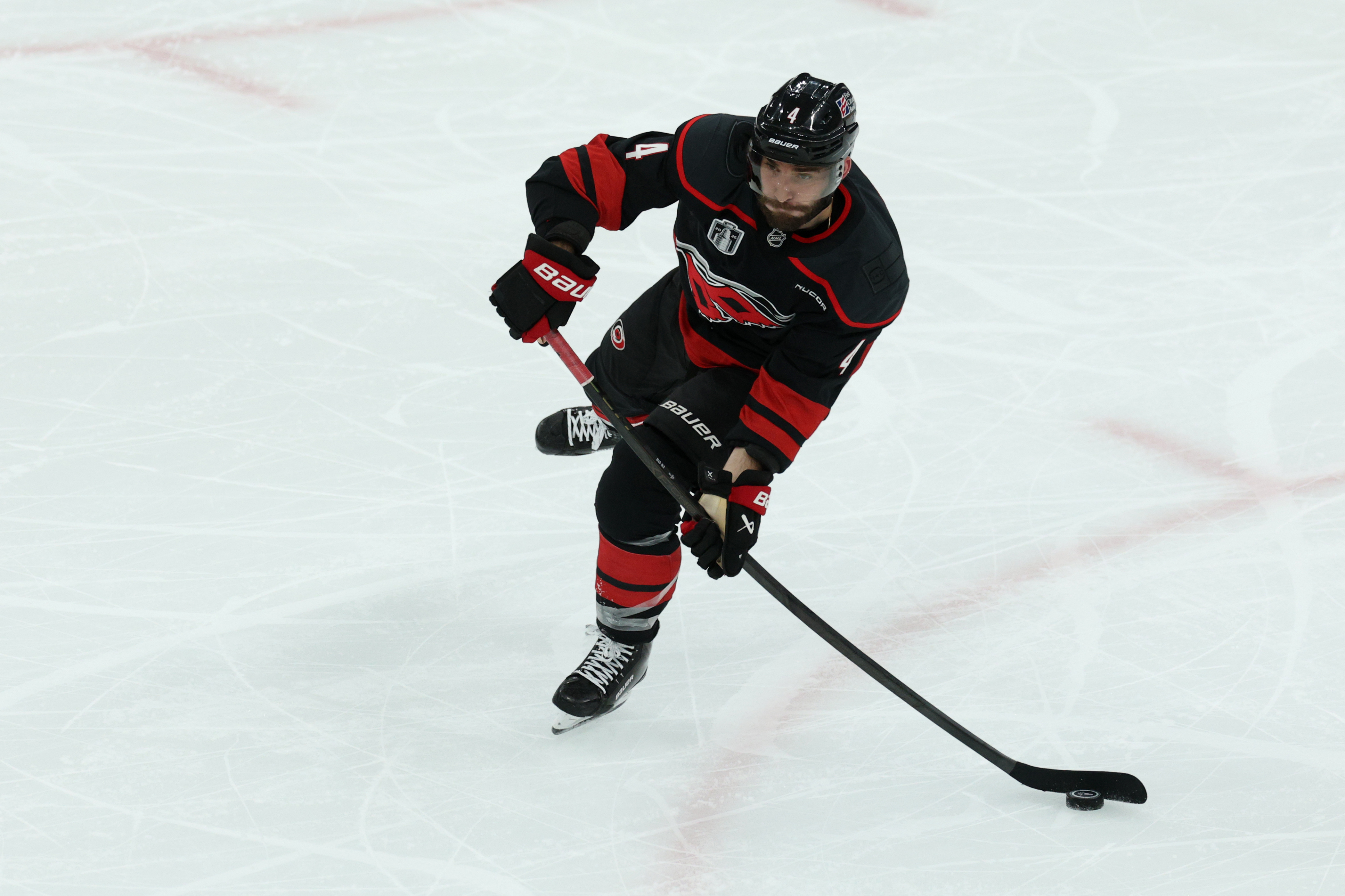 Carolina Hurricanes defenseman Shayne Gostisbehere (4) passes the puck as we provide our Hurricanes vs. Golden Knights prediction for Game 6 of the Stanley Cup Final.