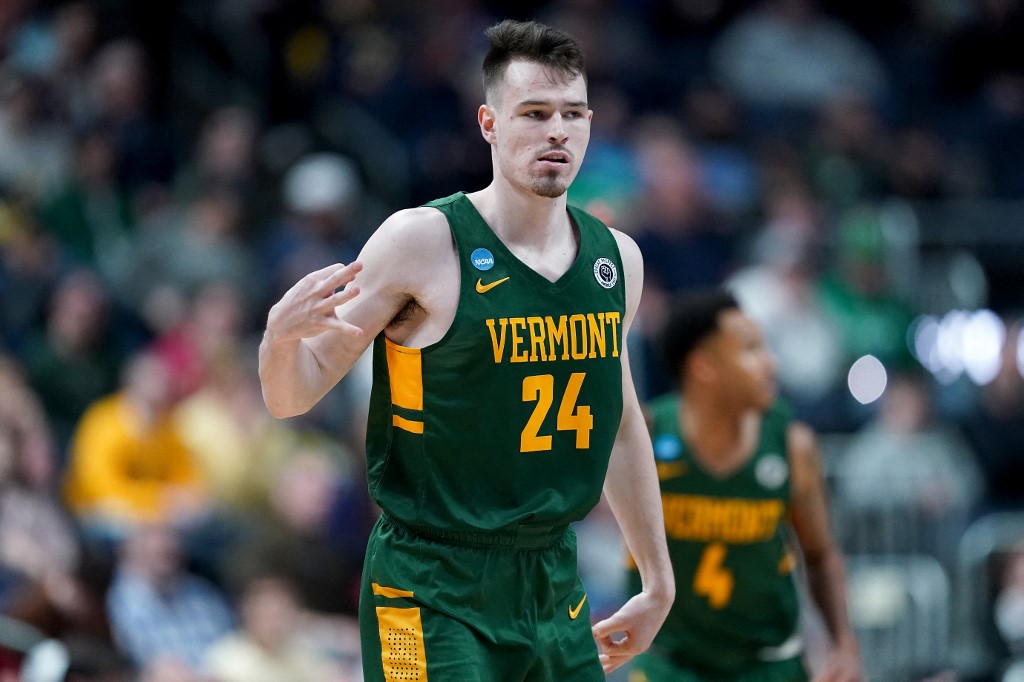 Matt Veretto #24 of the Vermont Catamounts celebrates a three point basket as we look at our best UMBC-Vermont prediction