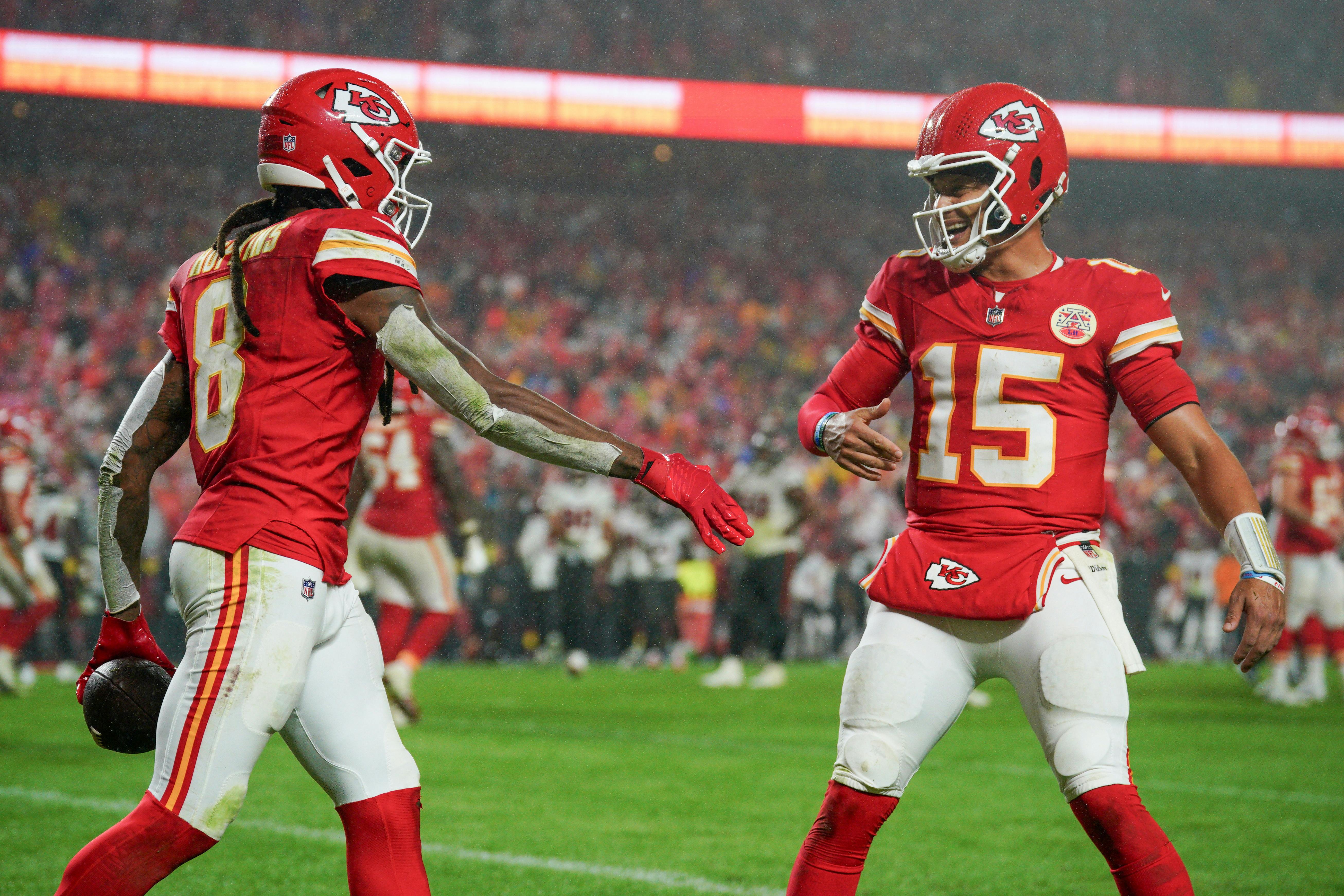 Kansas City Chiefs wide receiver DeAndre Hopkins celebrates with quarterback Patrick Mahomes as we look at the best Week 11 Odds & Betting Lines 