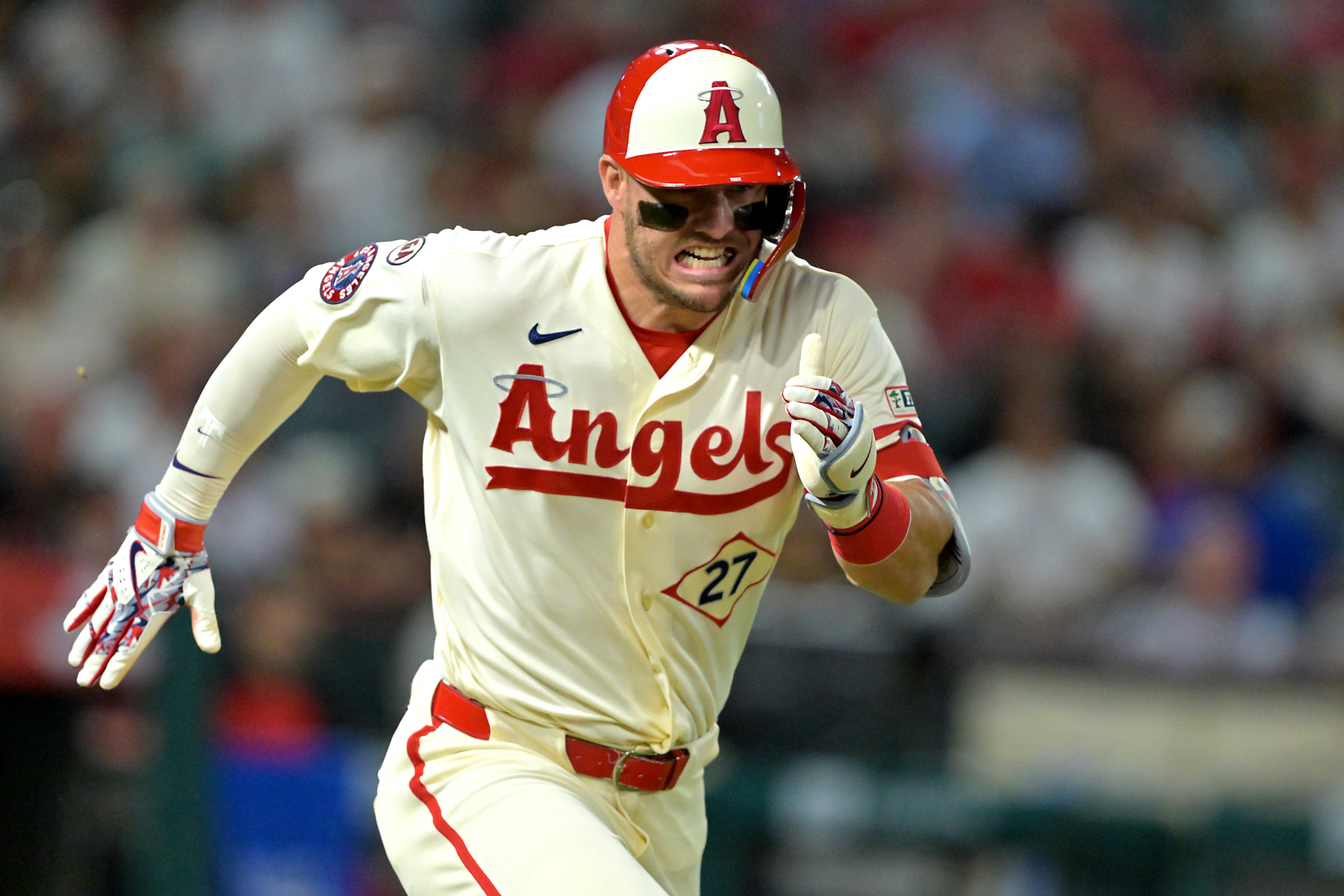 Los Angeles Angels center fielder Mike Trout runs to first as we make our best Rangers vs. Angels prediction.