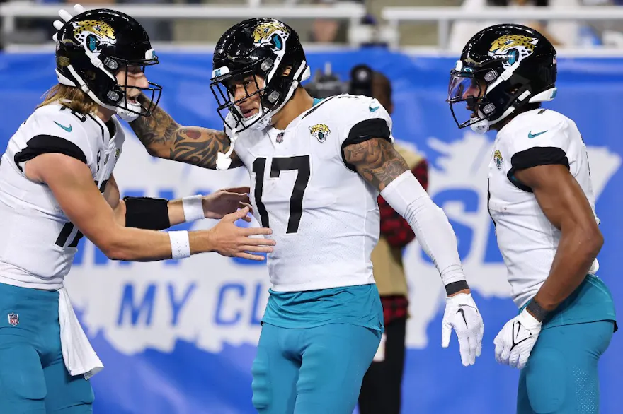 Evan Engram of the Jacksonville Jaguars celebrates after a touchdown with Trevor Lawrence against the Detroit Lions, and we offer our top Titans vs. Jaguars player props based on the best NFL odds.