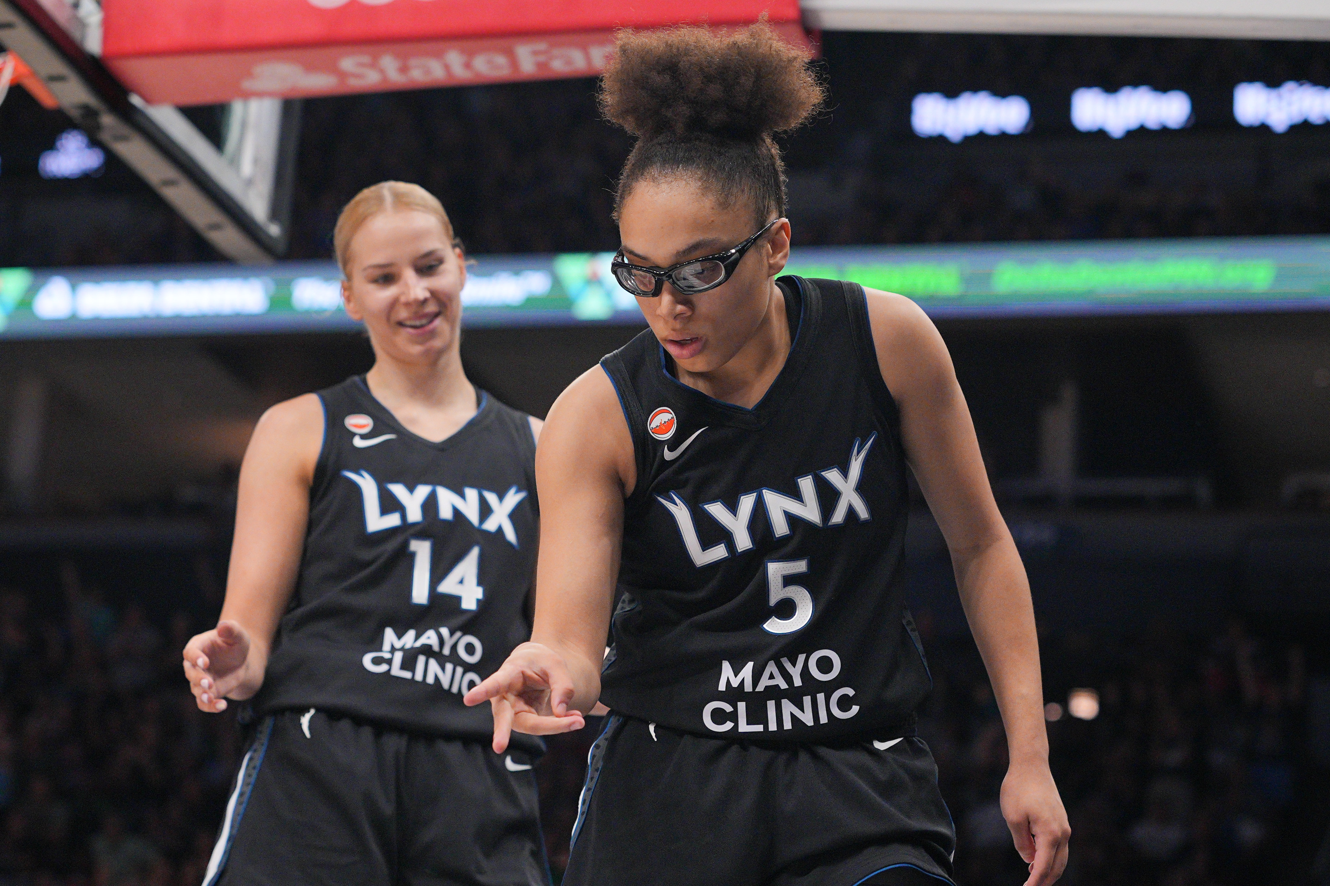 Minnesota Lynx forward Olivia Miles (5) celebrates as we break down our Wings vs. Lynx prediction.