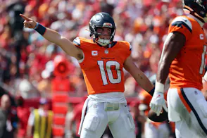 Denver Broncos quarterback Bo Nix reacts after he gets a first down as we look at the details of bet365's new US headquarters.