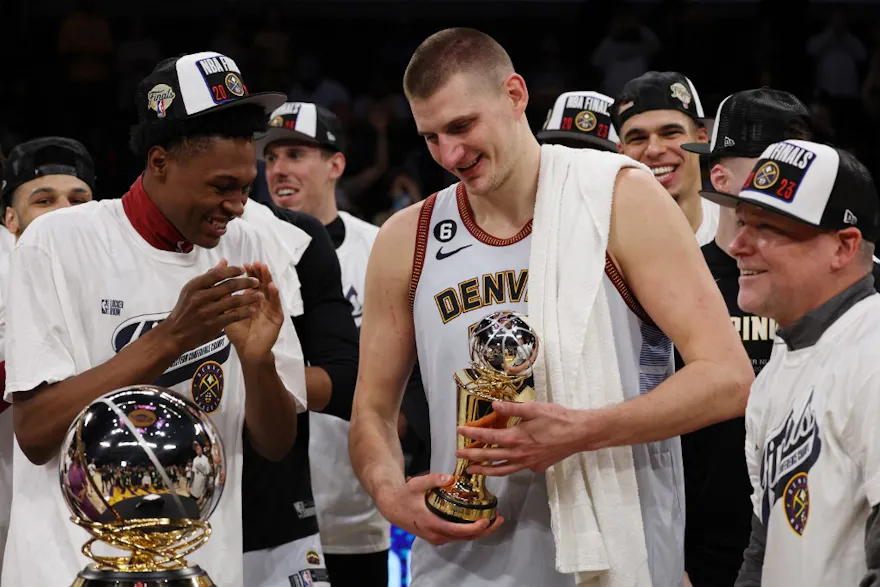 Nikola Jokic of the Denver Nuggets celebrates with teammates. Jokic will play for Serbia as we look at the Men's Olympic Basketball odds.