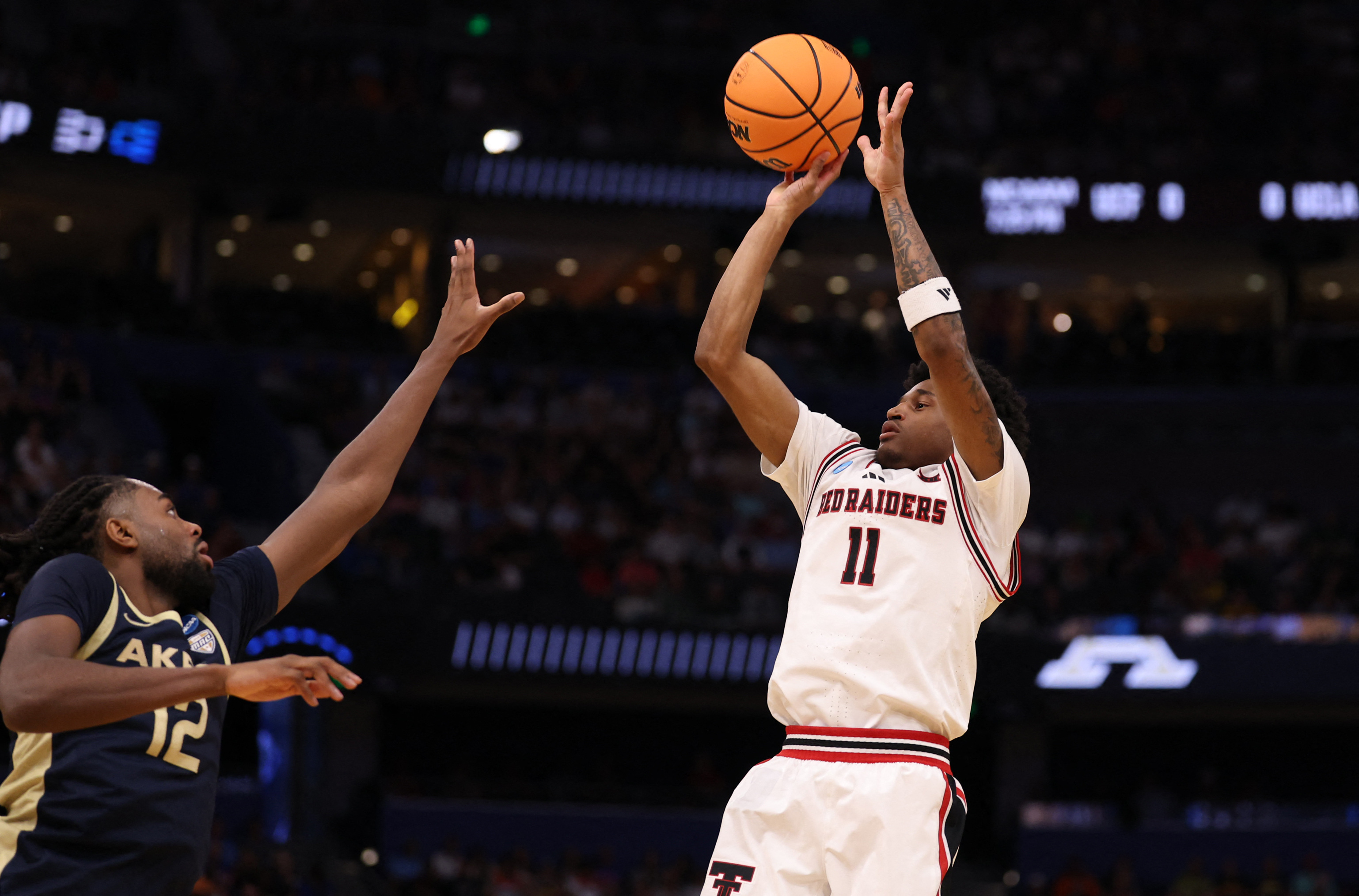 Texas Tech Red Raiders guard Jaylen Petty (11) shoots as we break down our second Round picks & best bets.
