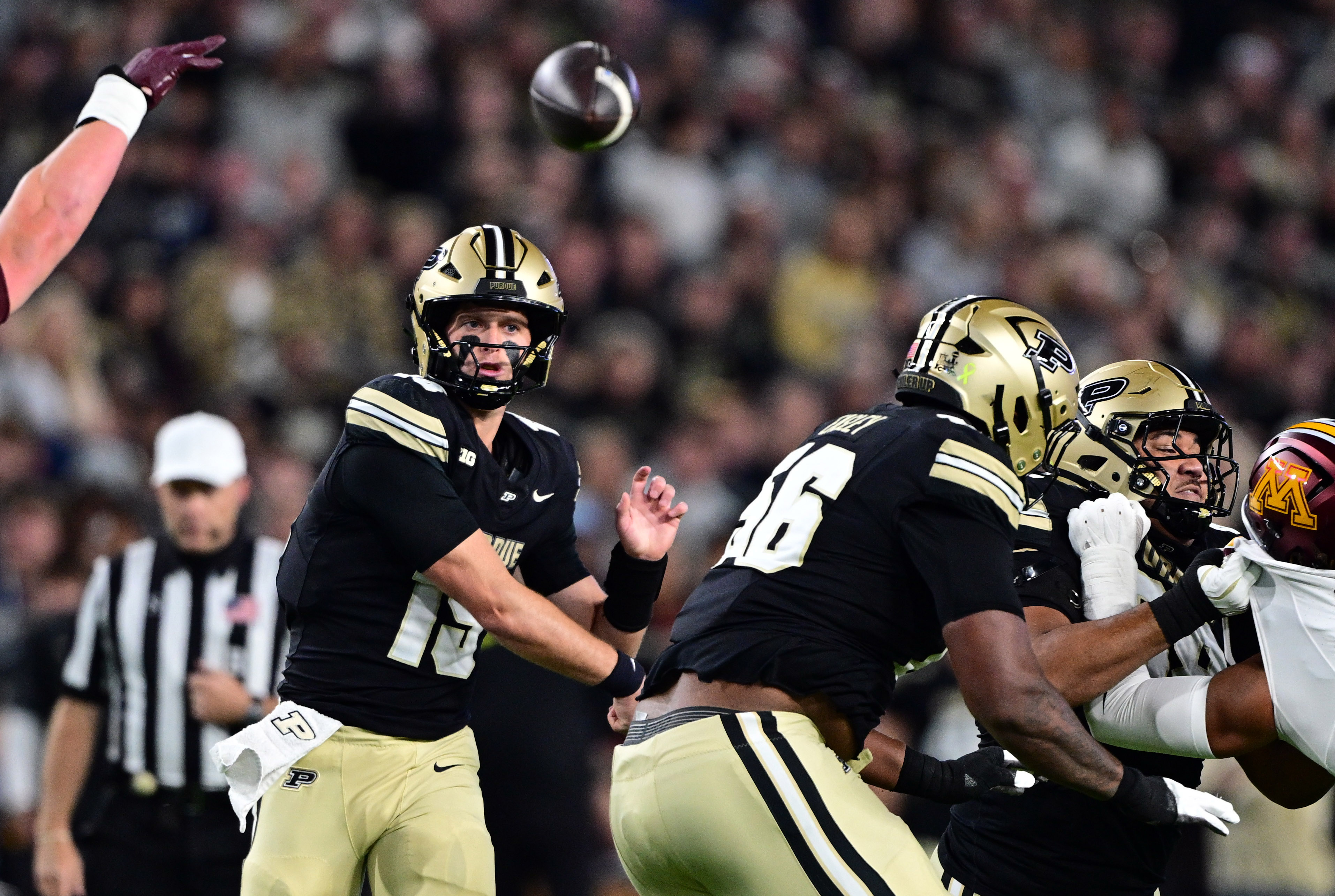 Pictured: Purdue quarterback Ryan Browne throwing a pass as we break down our Washington vs. Purdue Prediction. Photo by Marc Lebryk-Imagn Images.
