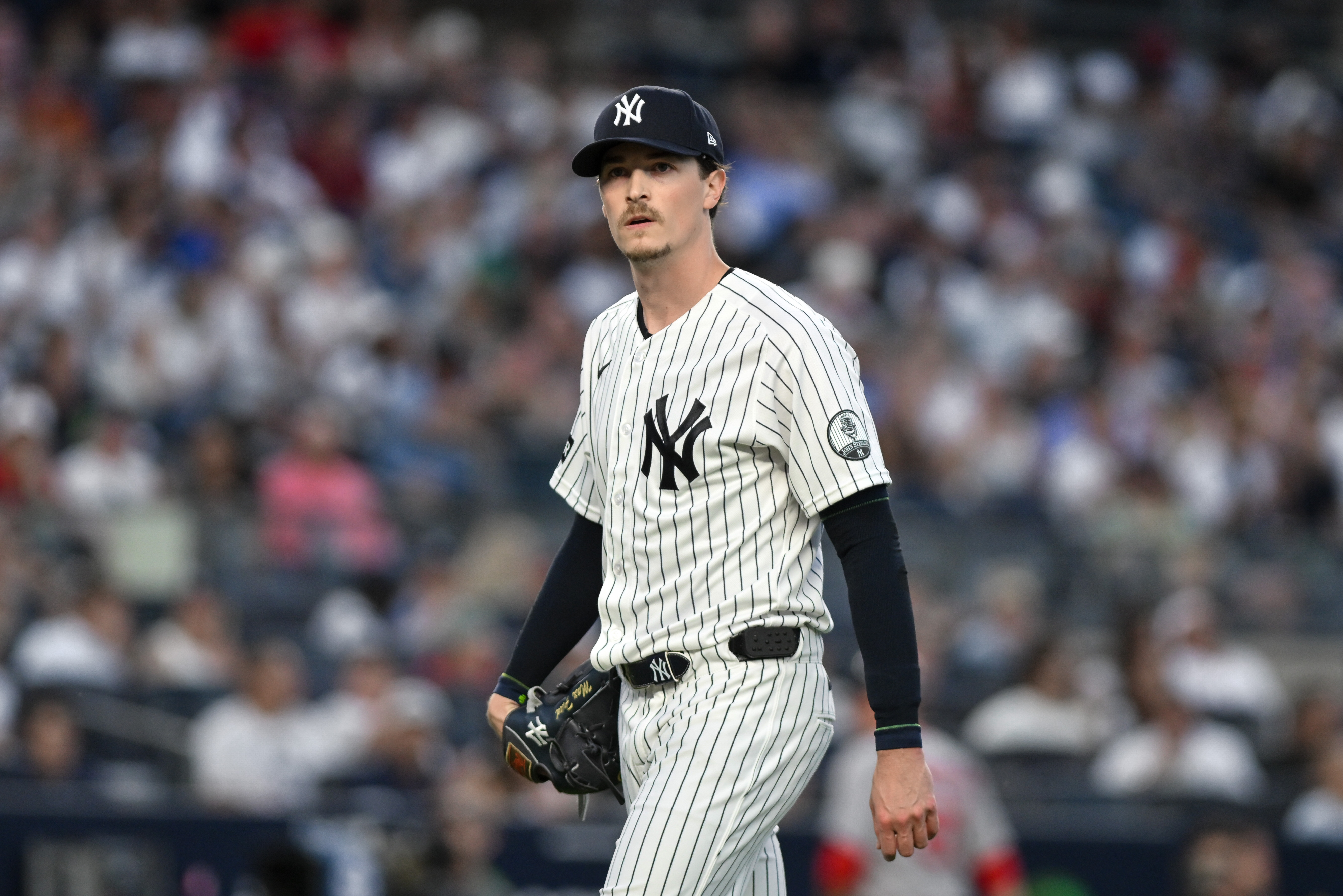 New York Yankees pitcher Max Fried (54) walks to the dugout as he is featured in our Yankees vs. Padres win probability.