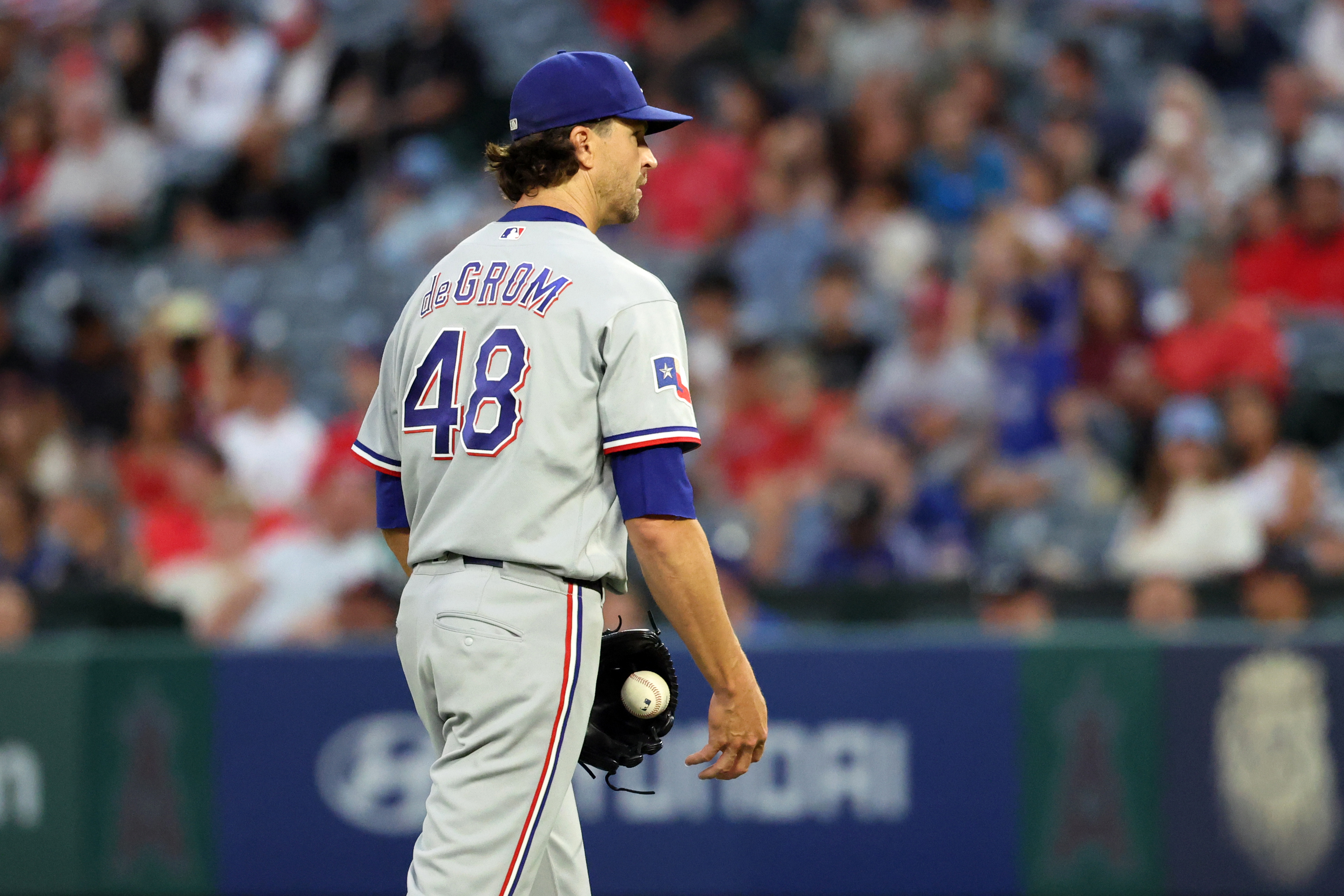 Texas Rangers pitcher Jacob Degrom (48) reacts as he is featured in our Nationals vs. Rangers win probability.